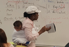 College Professor Teaches 3-Hour Class With Student’s Baby Strapped to Her Back After She Couldn’t Find a Sitter