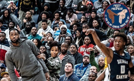 Lebron James and Wife Savannah Watching Their Son Lead His Team To Victory Against James’s Alma Mater Is One Of The Greatest Sports Moment Ever