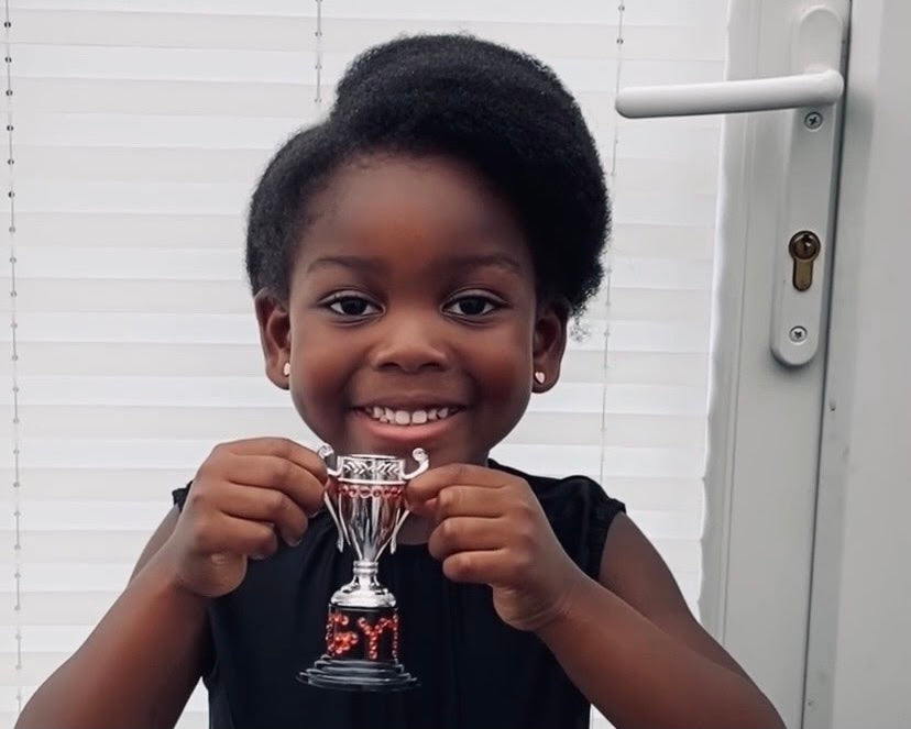 This Adorable 4-Year-Old Dedicates Her ‘Gymnast of the Week’ Trophy To Simone Biles