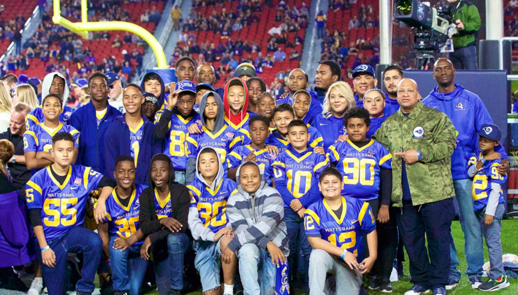 Watts Youth Football Team Goes Above and Beyond To Help Children In Underserved Communities